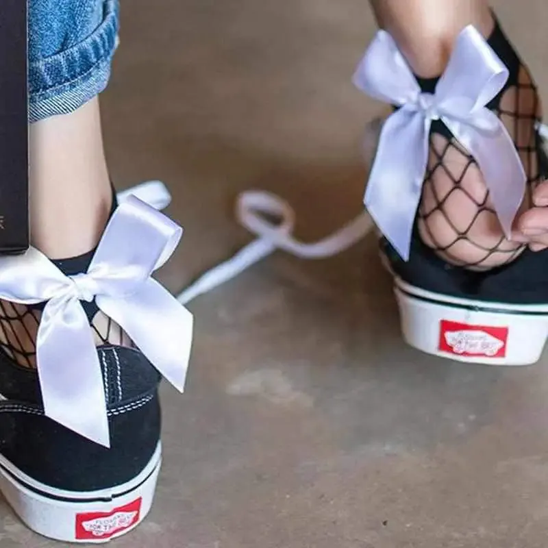 Chic Flair Bowtie Fishnet Socks Showcase Style