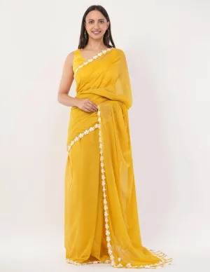 yellow while the lightweight mul cotton saree