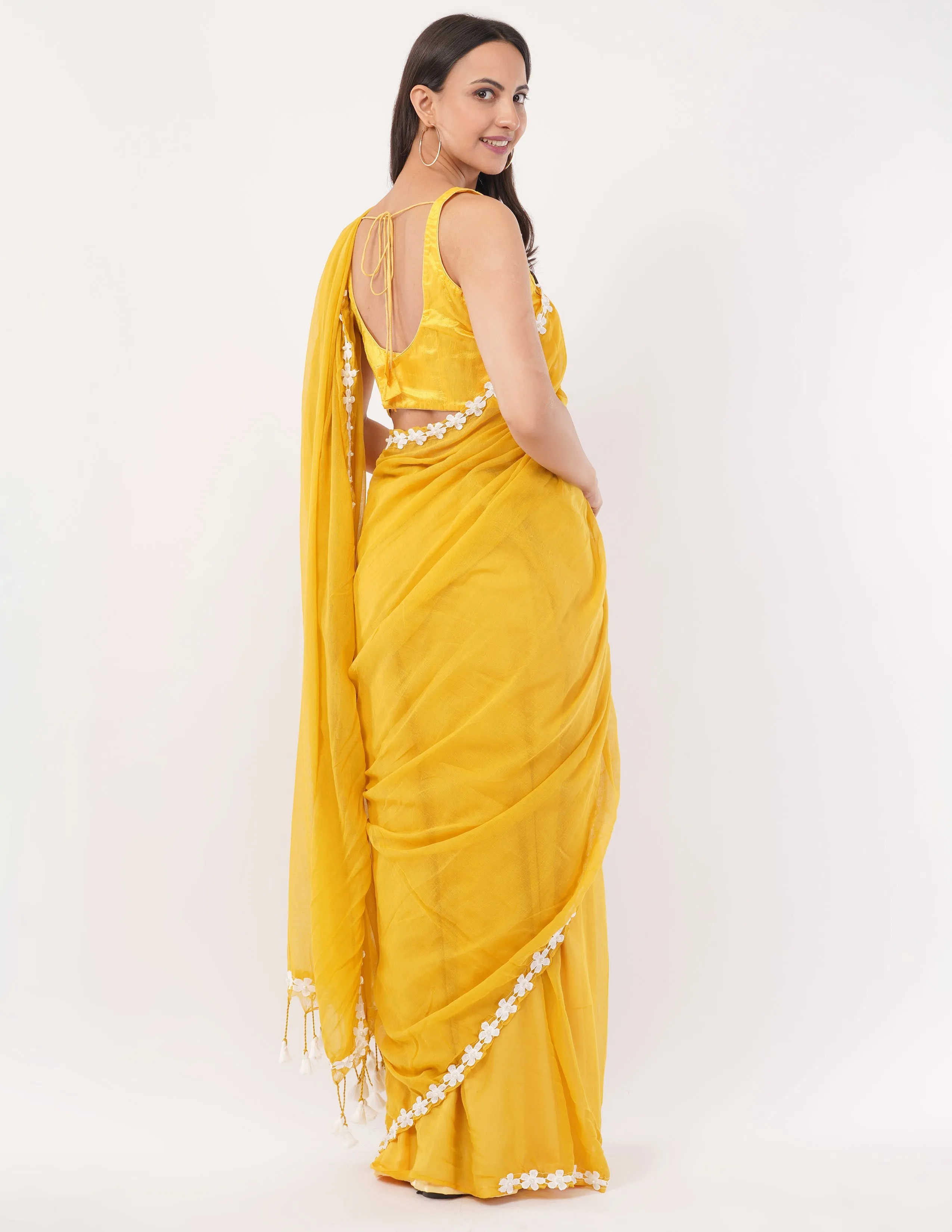 yellow while the lightweight mul cotton saree